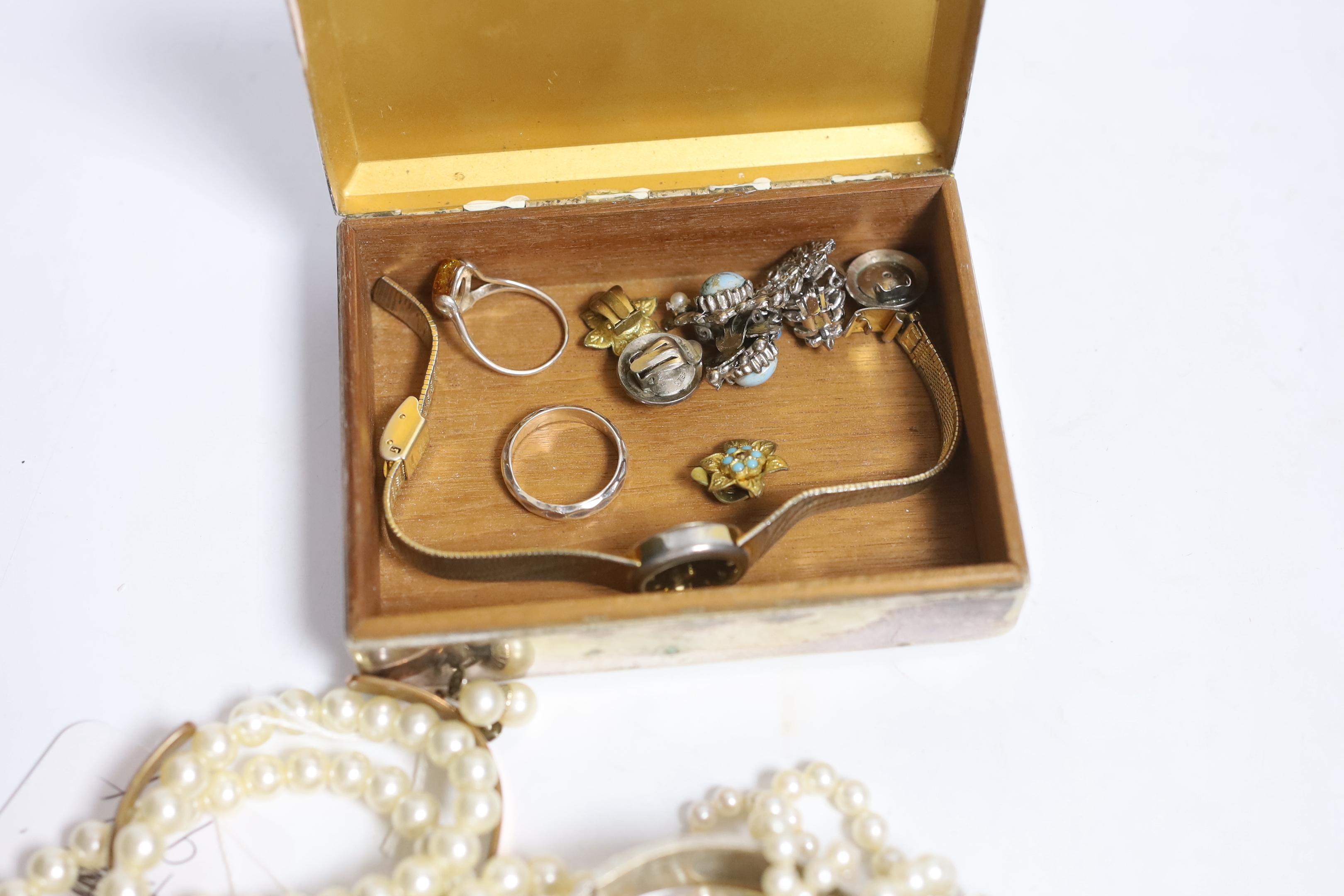 A double strand graduated cultured pearl necklace, with paste set white metal clasp, 44cm, a pair of 9ct and cultured pearl ear clips and a small quantity of assorted costume jewellery including two colour paste set brac